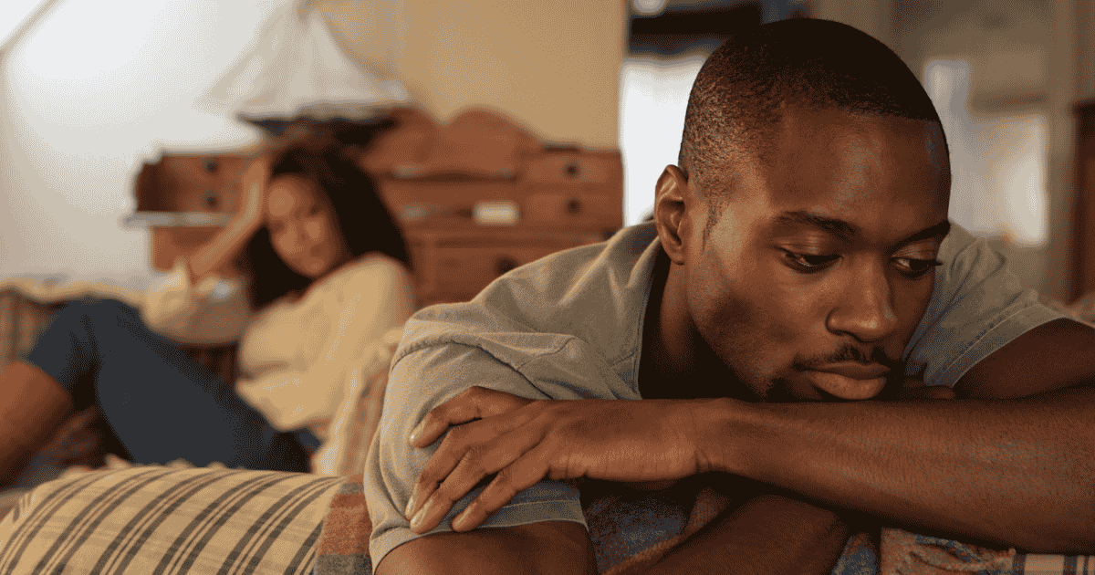 A man and a woman pictured on a couch feeling like they cannot connect